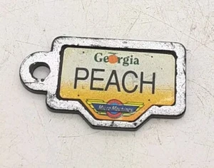 Vintage 1990 Galoob Micro Machines Licence Plate Georgia Peach  - Picture 1 of 2