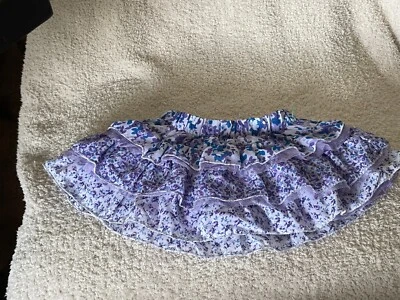 Minifalda con volantes Place con pantalones cortos incorporados talla 6 a 9M púrpura con flores Foto 1 de 3