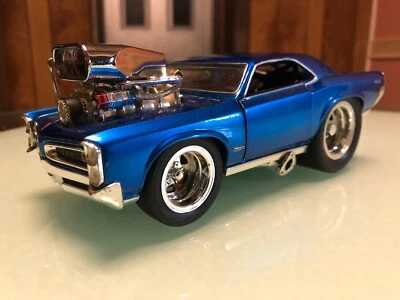 GOAT-MILK! TOUGH TO FIND (MUSCLE MACHINES) BLUE PONTIAC G.T.O. W/OPENING DOORS - Image 1 of 4