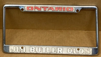 RARO OLDSMOBILE “JIM BUTLER” (ONTARIO CA.)  QUADRO DE PLACA DE CARRO - Imagem 1 de 4