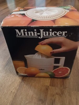 Mini exprimidor eléctrico de frutas cítricas Salton JC-1 de colección caja abierta Foto 1 de 4