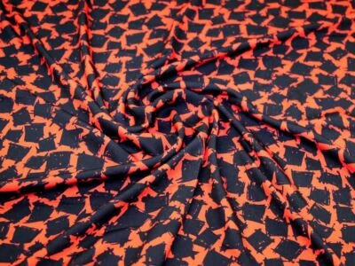 Tela crepé John Kaldor Madrid naranja y negro - por metro Foto 1 de 4