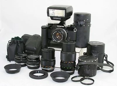 Cámara Olympus OM 1 MD 35mm SLR + 5x lente OM Zuiko + flash + bolsas.  Foto 1 de 4