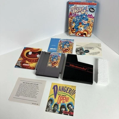 Trog (Nintendo Entertainment System, 1991) Caja Juego Manual Funda Póster CIB Foto 1 de 4