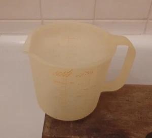 Tupperware 1803-4 Becher 1,1 kg. Messbecher gelb Vintage - Bild 1 von 4