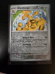 Gholdengo 131/191 Sv08: Surging Sparks Reverse Holo - Picture 1 of 2