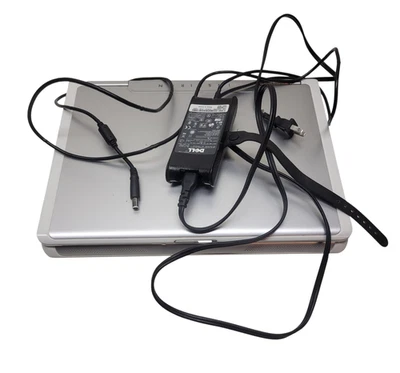 Computadora portátil Dell Inspiron 1501 15,4" AMD Turion plateada con fuente de alimentación Foto 1 de 4