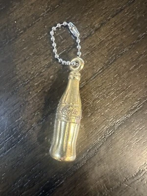 Coca Cola Gold Tone  Mini Bottle Keychain 1 1/2" Plastic w silver colored chain - Image 1 of 2