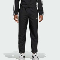 white adidas joggers with black stripes