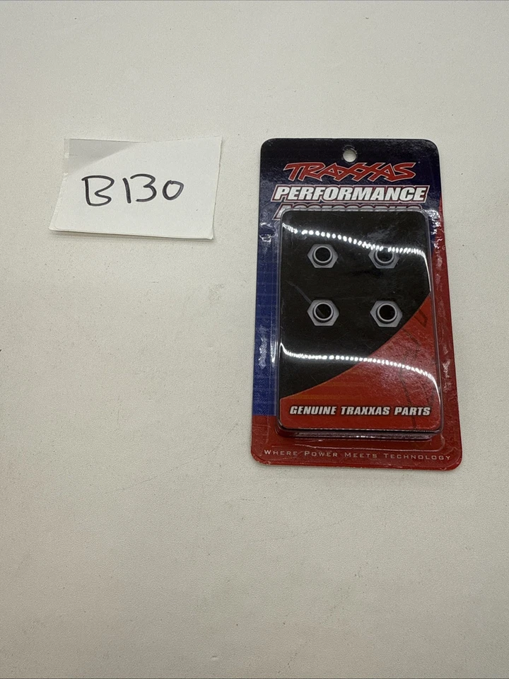 Traxxas. 8269A Wheel hubs, 12mm hex, 6061-T6 aluminum (charcoal gray-anodized) - Image 1 of 1