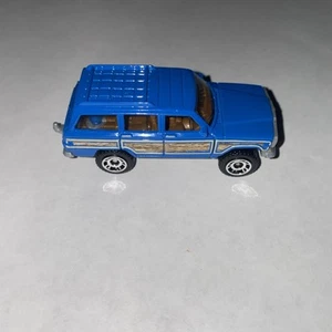 2017 Matchbox '89 Jeep Grand Wagoneer Blue 1:64 Diecast Toy Race Car - Picture 1 of 6