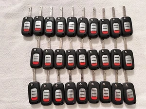 LOTE DE 28 LLAVEROS A DISTANCIA ORIGINALES ORIGINALES PARA COCHE INTELIGENTE A GRANEL - Imagen 1 de 2
