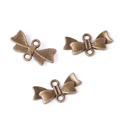 50 conectores de eslabones de moño de aleación de bronce antiguo sin níquel artesanías 20X10X3 mm Foto 1 de 4