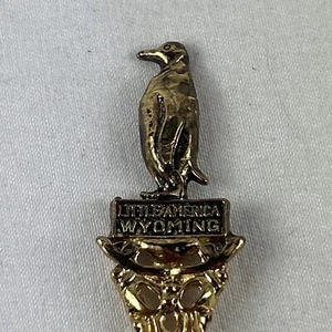 Little America Wyoming Souvenir Spoon 4.5” Gold Tone USA Penguin - Picture 1 of 4