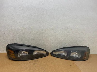 Faro negro lado izquierdo+derecho Pontiac Grand Prix 2004 a 2008 OEM S5561 CV Foto 1 de 4
