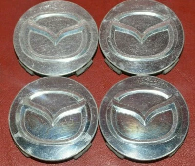 Tapacubos centrales protectores para rueda Mazda 626 Millenia 2112 OEM Foto 1 de 4