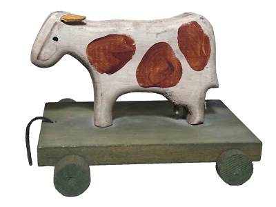 Juguete de madera vintage para tirar de vaca arte popular orejas de cuero americanas antiguas Foto 1 de 4