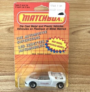 1986 MATCHBOX SUPERFAST MB49 WHITE PEUGEOT QUASAR FRENCH CANADIAN CARD - Picture 1 of 4
