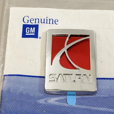 Nuevo emblema de puerta delantera con logotipo de GM Saturn 05-07 Saturn Reley se adapta a derecha/derecha Foto 1 de 4