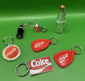 Vintage Lot of Seven (7) Enjoy Coca-Cola/Coke Keychains from the 1980's-1990's - Picture 1 of 23