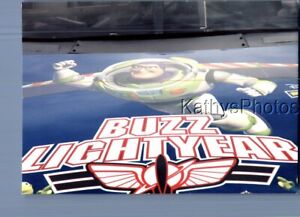 FOUND COLOR PHOTO J_0149 VIEW OF BUZZ LIGHTYEAR ON HOOD OF CAR