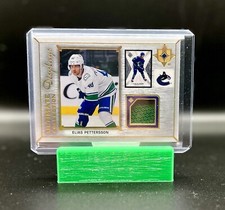 2021-22 Upper Deck Ultimate Collection Displays Elias Pettersson Jersey Card