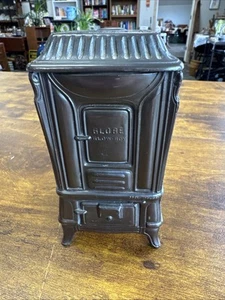 Banco de monedas de bronce vintage American Art Works Globe Stove & Range Co Kokomo-sin llave - Imagen 1 de 9