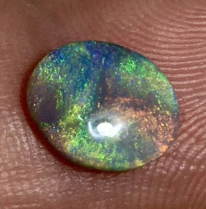 1.10ct AUSTRALIA LIGHTING RIDGE GLITTERY FLUID RED MULTI FIRE 10x8mm BLACK OPAL - Bild 1 von 12