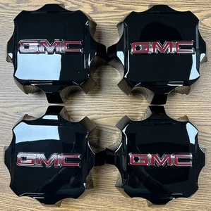 7" GMC Sierra 2500, 3500 OEM Black Center Cap #84627947 set - Picture 1 of 2