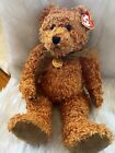 TY teddy 100th anniversary bear with tags and medallion at Neck