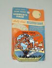 1964 65 NEW YORK WORLD'S FAIR METAL DIME BANK UNUSED ON ORIGINAL CARD NICE!