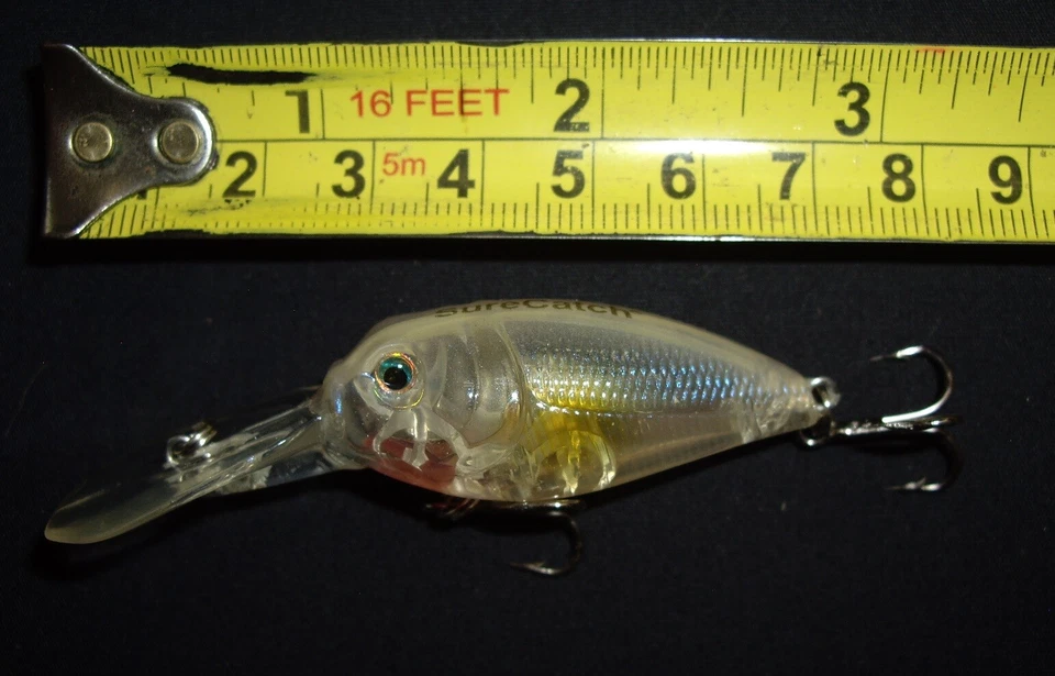 RARO SEÑUELO DE PESCA VINTAGE... SURECATCH 2009 TRANSPARENTE PECES MOLLEJAS SONAJERO. Foto 1 de 4