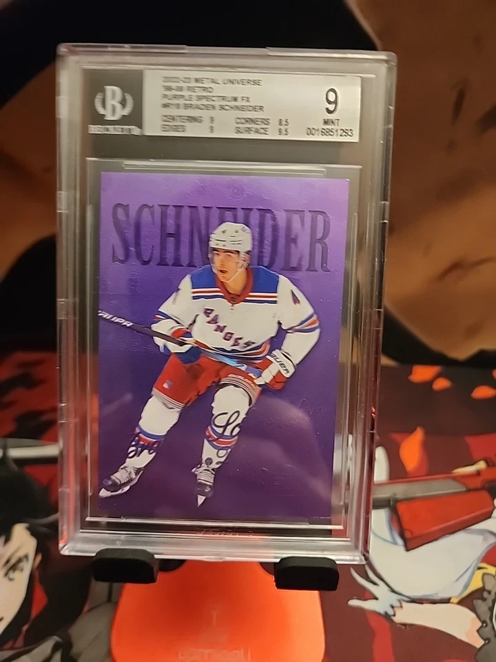 BGS 9 Braden Schneider 2022-23 Metal Universe Purple Spectrum RC Card #64/199 - Image 1 of 3