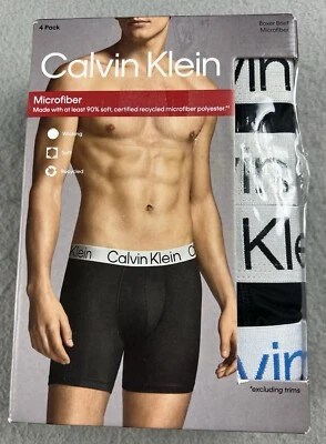Paquete de 4 calzoncillos boxer de microfibra Calvin Klein para hombre talla M negros/azules/grises Foto 1 de 4
