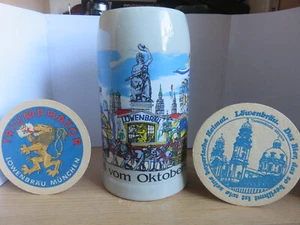 Löwenbräu Bierkrug-Maßkrug 1L-Gruß vom Oktoberfest+2 Bierdeckel,Brauerei München - Bild 1 von 5