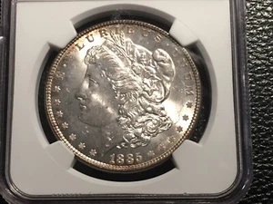 1885 morgan dollar NGC 64 uncirculated original gold rim toning - Picture 1 of 5