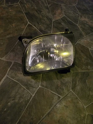 Conjunto de faros izquierdos lado del conductor Toyota Tacoma 2001-04 usados OEM Foto 1 de 4