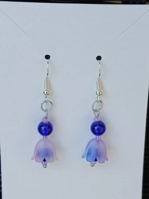 Pendientes flor morada con piedra azul real Foto 1 de 4