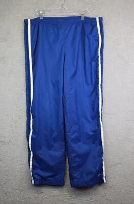 Pantalones deportivos Nike vintage para hombre XL azules a rayas holgados Y2K cortavientos cremallera lateral años 90 Foto 1 de 4