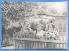Three beautiful girls at the fence Long pigtail Vintage photo