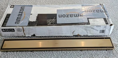 Delta DT0732413-CZ Reversible 24 Pulgadas Lineal Ducha Drenaje Borde Champagne Bronce  Foto 1 de 4