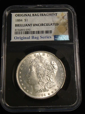 1884 P $1 Morgan Silver Dollar NGC BRILLIANT UNCIRCULATED ORIGINAL BAG FRAGMENT - Image 1 of 4