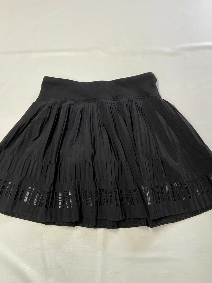 Pantalones Cortos Niñas IVIVVA Negros Forrados Sprint Completo Plisado Skort Talla 12 Foto 1 de 4