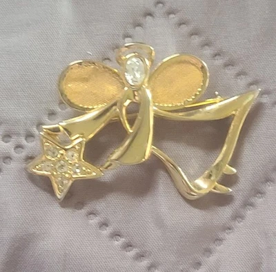 Broche/Pin de Colección Avon Tono Dorado Ángel de la Guarda Transparente Estrás sosteniendo una estrella  Foto 1 de 4