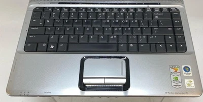 HP Pavilion DV2000 (AMD Turion, 2GB RAM, 320GB HDD,Windows 10) Con Cable Sin Cargador Foto 1 de 4