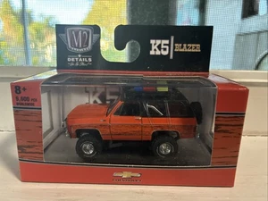 M2 Machines 1973 Chevrolet K5 Blazer Cheyenne orange mit Dachträger 1:64 - Bild 1 von 3