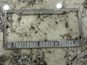 Fraternal Order Of Police License Plate Frame Silver Metal 12" x 6" USED - Foto 1 di 3