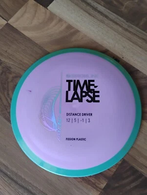 Axiom Disc Golf Simon Lizotte Line Fission Time Lapse Driver 175 G Purple/Teal  - Image 1 of 4