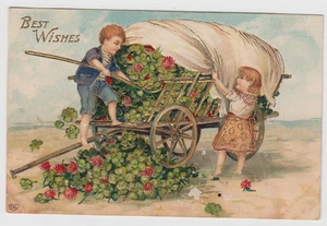 Best Wishes Children Shoveling Four Leaf Clovers Wagon Gold Postcard - Picture 1 of 2