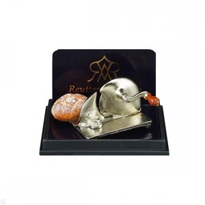 Reutter Porcelain - Cortadora de pan en miniatura para casa de muñecas con pan - Imagen 1 de 4